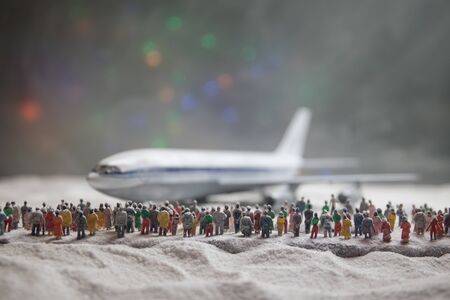 Merry Christmas and Happy new years travel concept background for winter trip. Christmas background with airplane. Creative artwork decoration on snow. Selective focus.の写真素材