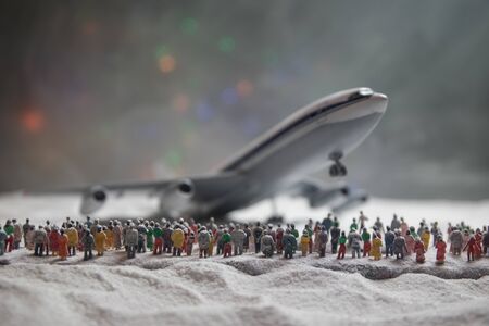 Merry Christmas and Happy new years travel concept background for winter trip. Christmas background with airplane. Creative artwork decoration on snow. Selective focus.の写真素材