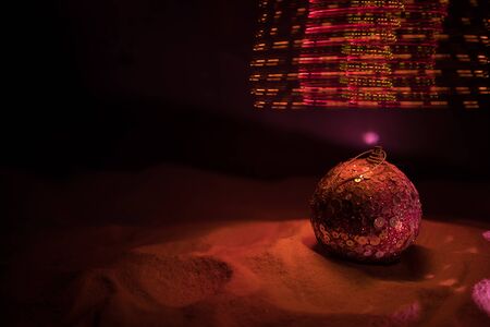 Winter holidays concept. Christmas background with baubles, on snow, free space for text. Christmas...