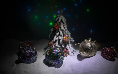 Winter holidays concept. Christmas background with baubles, on snow, free space for text. Christmas decoration. Festive background. Empty space for textの写真素材