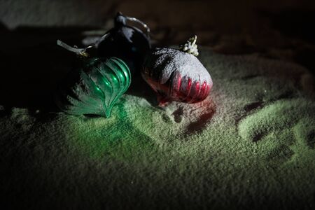 Winter holidays concept. Christmas background with baubles, on snow, free space for text. Christmas decoration. Festive background. Empty space for textの写真素材