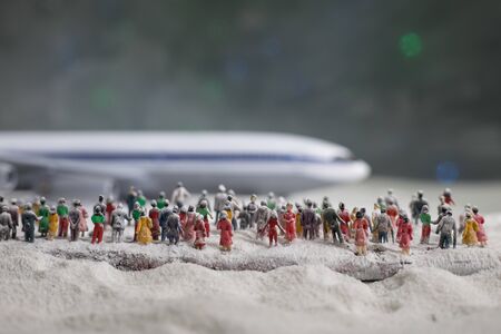 Merry Christmas and Happy new years travel concept background for winter trip. Christmas background with airplane. Creative artwork decoration on snow. Selective focus.の写真素材