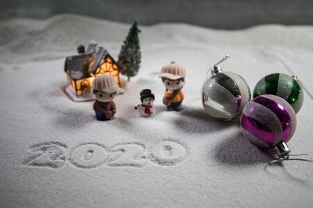 Winter holidays concept. Christmas background with baubles, on snow, free space for text. Christmas decoration. Festive background. Empty space for textの写真素材