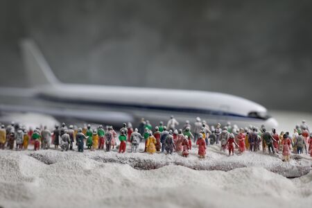 Merry Christmas and Happy new years travel concept background for winter trip. Christmas background with airplane. Creative artwork decoration on snow. Selective focus.の写真素材
