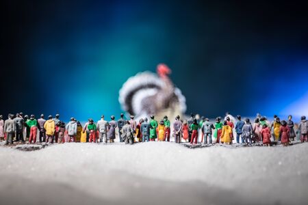 Thanksgiving celebration funny concept. Artwork decoration with Turkey tom statue on snow. Selective focus. Empty space for your textの写真素材