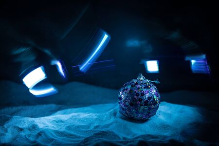 Winter holidays concept. Christmas background with baubles, on snow, free space for text. Christmas decoration. Festive background. Empty space for textの写真素材