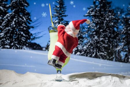 New Year and Christmas party concept. Different tasty cocktails with creative New Year holiday artwork decoration on background. Colorful cocktail in glass. Party club entertainment. Copy space.の写真素材