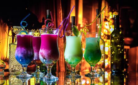 New Year and Christmas party concept. Different tasty cocktails with creative New Year holiday...