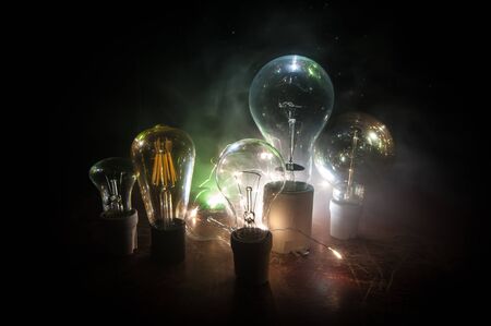 Beautiful retro luxury light lamp decor glowing. Abstract dark background with creative artwork decoration of glowing bulbs.の写真素材