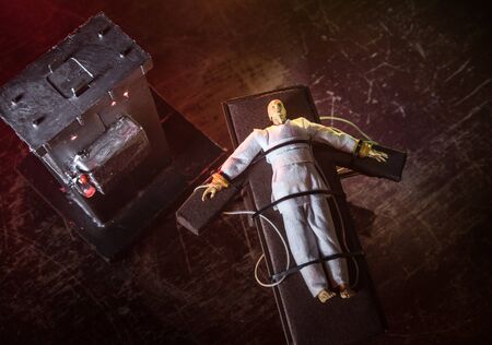 Lethal injection concept. Prisoner handcuffed to death by lethal injection. Creative artwork...