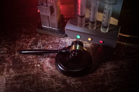 Lethal injection concept. Prisoner handcuffed to death by lethal injection. Creative artwork...