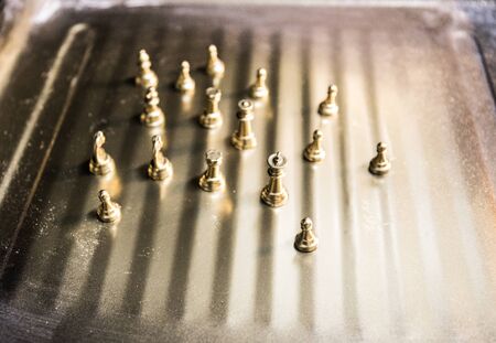 Chess board game concept of business ideas and competition. Chess figures on a dark background with smoke and fog. Selective focusの写真素材