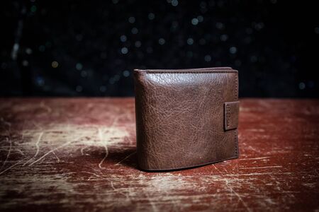 Stylish men's purse with money on wood background. men's purse with money, credit and debit cards on the wooden tableの写真素材