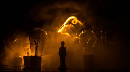 Beautiful retro luxury light lamp decor glowing. Abstract dark background with creative artwork decoration of glowing bulbs.の写真素材