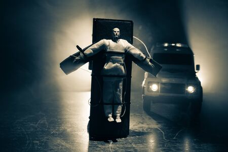 Lethal injection concept. Prisoner handcuffed to death by lethal injection. Creative artwork...
