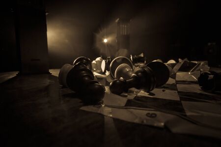 Chess board game concept of business ideas and competition. Chess figures on a dark background with...