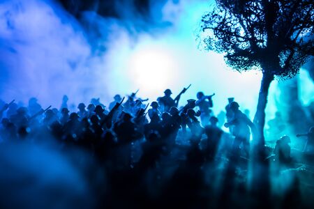 War Concept. Military silhouettes fighting scene on war fog sky background, World War Soldiers...