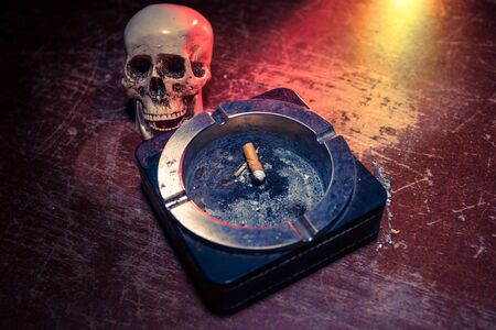 No smoking concept. Creative artwork table decoration with cigarettes. Cigarettes cause cancer and...