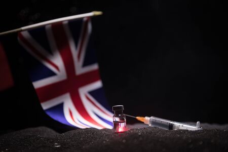 World Corona virus attack concept. Concept of fight against virus, danger and public health risk disease. National flags on dark background. Creative artwork decoration. Selective focusの写真素材