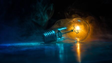 Beautiful retro luxury light lamp decor glowing. Abstract dark background with creative artwork decoration of glowing bulbs.の写真素材