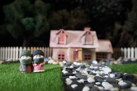 Miniature people : Citizens wearing masks to protect against viruses. People wear masks to prevent New type COVID-19 pneumonia. Coronavirus and Covid-19 concept. Selective focusの写真素材