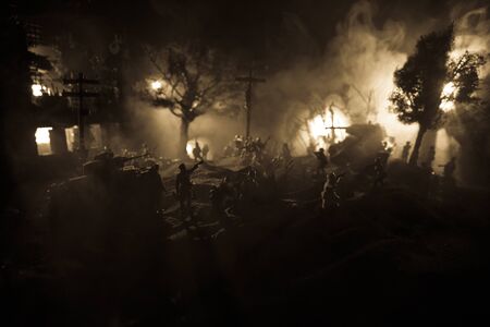 War Concept. Military silhouettes fighting scene on war fog sky background, World War Soldiers Silhouette Below Cloudy Skyline At night. Battle in ruined city. Selective focusの写真素材
