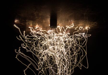 Beautiful retro luxury light lamp decor glowing. Abstract dark background with creative artwork...