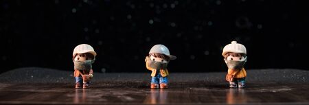 Miniature people : Citizens wearing masks to protect against viruses. People wear masks to prevent New type COVID-19 pneumonia. Coronavirus and Covid-19 concept. Selective focusの写真素材