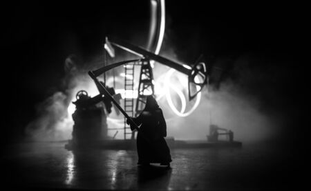 Oil industry crisis concept. Oil stock crisis because Covid global pandemic. Oil pump and oil...