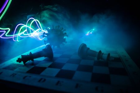 Chess board game concept strategy of business in Covid global pandemic. Big Corona virus miniature...