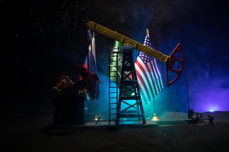 Business dialogue, oil agreement concept: National flags with Oil pump and oil refining factory at...