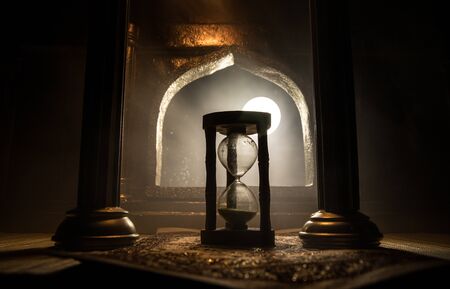 Time concept. A realistic Arabian interior miniature with window and columns. Silhouette of...