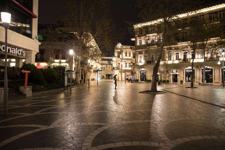 BAKU, AZERBAIJAN - APRIL 7, 2020 - Downtown Baku, Azerbaijan. Empty streets of Baku, the capital of Azerbaijan at night. Covid pandemic happeningのeditorial素材