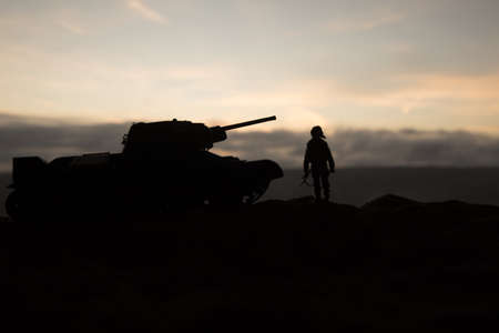 War Concept. Military silhouettes fighting scene on war fog sky background, World War Soldiers...