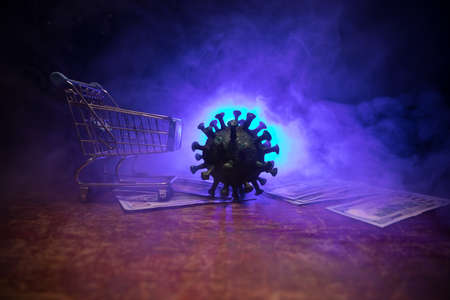 Corona virus global economy crisis concept. Corona virus miniature, money and abacus on wooden table...