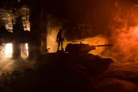 War Concept. Military silhouettes fighting scene on war fog sky background, World War Soldiers...
