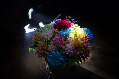 Beautiful and colorful flower bouquet, on dark bakground. Floral bouquet of different flowers. Best...