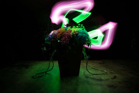 Shadow of soldiers on wall at night. Army concept. Fighting silhouettes on colored stone wall. Selective focusの写真素材