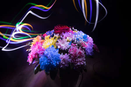 Beautiful and colorful flower bouquet, on dark bakground. Floral bouquet of different flowers. Best for a greeting card. Selective focusの写真素材