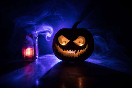 Halloween pumpkin smile and scary eyes for party night. Close up view of scary Halloween pumpkin...