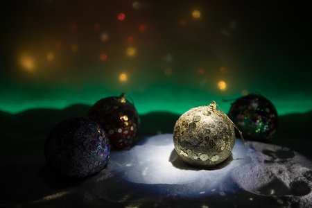 Winter holidays concept. Christmas background with baubles, on snow, free space for text. Christmas decoration. Festive background. Empty space for textの写真素材