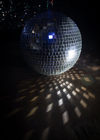 Colorful disco mirror ball lights night club background. Party lights disco ball. Selective focusの写真素材
