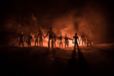 Scary view of zombies at cemetery with cloudy sky and fog, Horror Halloween concept. Selective focus