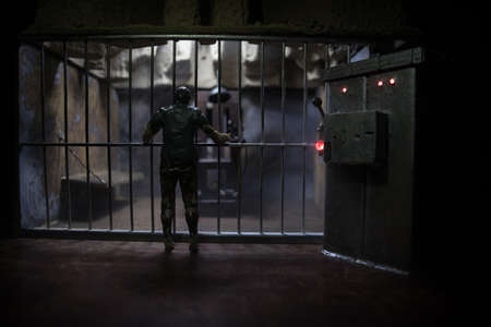 Execution concept. Death penalty electric chair miniature in selective focus inside old prison. Old...