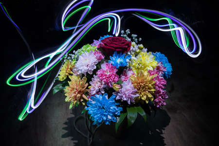 Beautiful and colorful flower bouquet, on dark bakground. Floral bouquet of different flowers. Best for a greeting card. Selective focusの写真素材