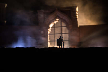 Medieval battle scene. Silhouettes of figures as separate objects, fight between warriors at night....