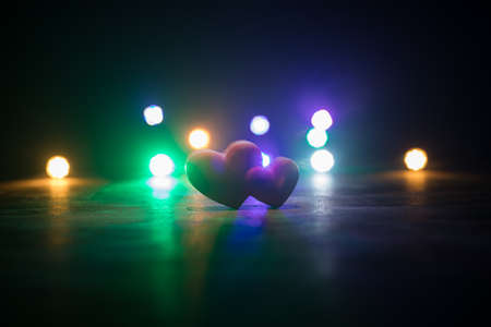 Valentines background. Valentine's Day heart on a dark wooden table. Dark toned foggy background. Selective focusの写真素材