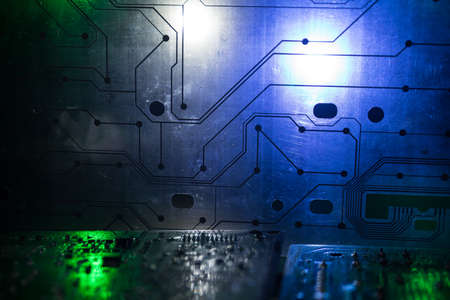 Creative concept of modern technology, inside an electronic device. Electronic circuit board close...