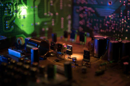 Creative concept of modern technology, inside an electronic device. Electronic circuit board close...