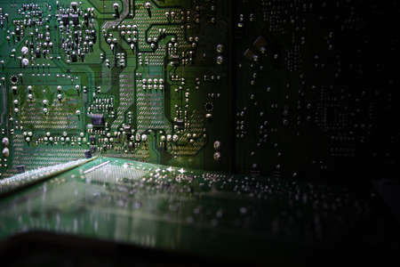 Creative concept of modern technology, inside an electronic device. Electronic circuit board close...